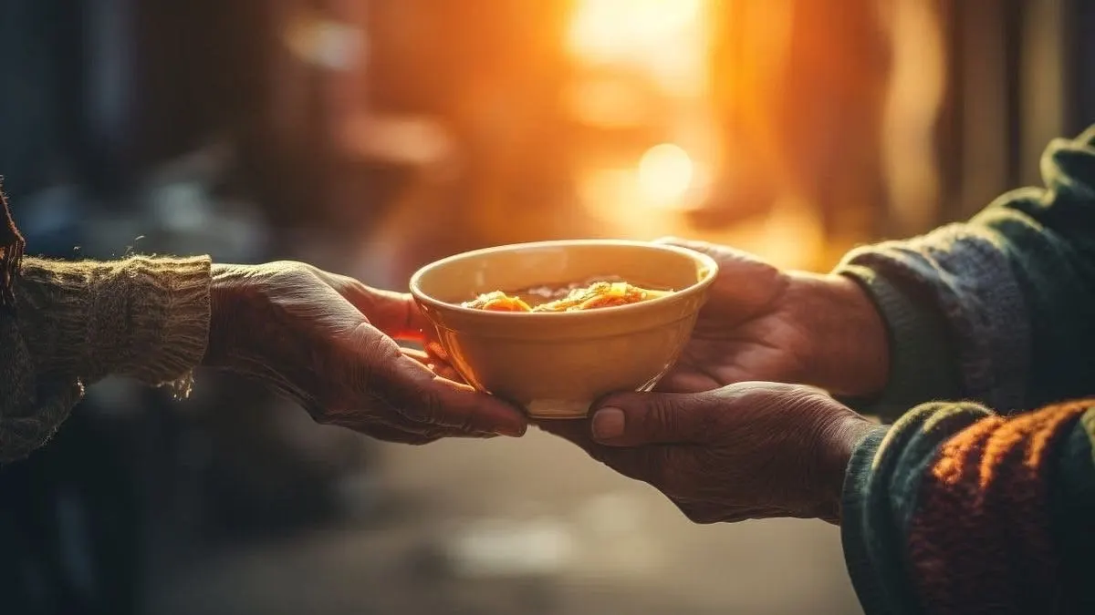 Hands sharing a bowl of food